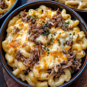 This Shredded Beef Mac & Cheese is the perfect comfort food for any occasion! Creamy, cheesy pasta meets tender, flavorful beef for a hearty dish that everyone will love. Ideal for family dinners or game day gatherings, this recipe will definitely become a favorite. Don't forget to save it for your next meal prep!