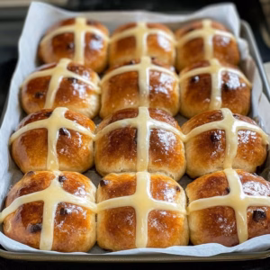 Warm, soft, and oh-so-delicious! These Traditional Hot Cross Buns are filled with hints of spice and studded with juicy raisins, making them a perfect treat for Easter or any cozy gathering. You'll love how easy they are to make from scratch! Save this recipe for a delightful baking experience that brings smiles to the table. Perfect with butter or as a sweet breakfast treat!